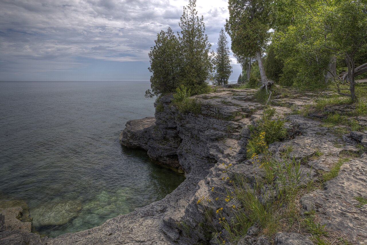 Rocky Lake Michigan shoreline and trees at Cave Point County Park in June 2013